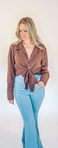 Tie in front or wrap around to back * Button detail on sleeves * Single button on bust area. Spring styles for women, spring tops for women, spring clothing