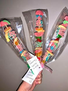 four candy candies wrapped in cellophane and labeled with the words gummy bears