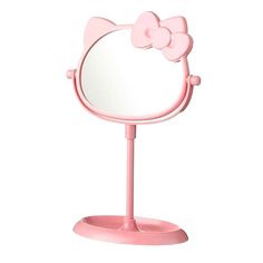 a pink hello kitty mirror on a stand