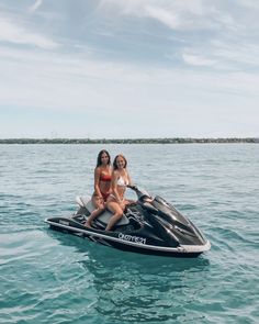 two women on a jet ski in the water