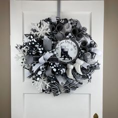 a black and white wreath on the front door