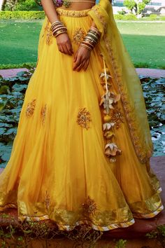 Yellow lehenga with floral motif embroidery. Paired with ivory embroidered blouse and scalloped dupatta.
Component: 3
Pattern: Embroidered
Type Of Work: Zardozi
Neckline: Crew
Sleeve Type: Half
Fabric: Raw Silk, Silk Organza, Lining: Shantoon
Color: Yellow
Other Details: 
Cut-out blouse details
Side tassel tie-up lehenga
Bead hem blouse
Scalloped hem dupatta
Occasion: Destination Wedding - Aza Fashions Floral Bridal Lehenga, Scalloped Dupatta, Indian Things, Motif Embroidery, Yellow Lehenga, Blouse Details, Anarkali Dress Pattern, Embroidered Lehenga, Hem Blouse