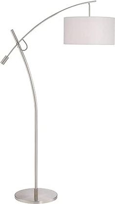 a floor lamp with a white shade on it and a silver base, in front of a