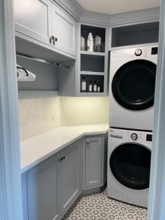 a washer and dryer in a small room