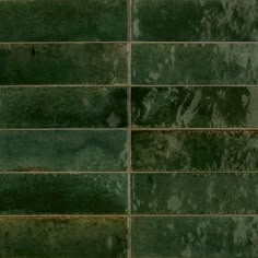 green tiles with rusted edges are shown in this image