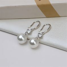 Sterling Silver Earring Settings, s925 Silver CZ Hook Earrings, Earring Blanks Tray, Half Drilled Pearl Beads, Cup and Peg,Earring Component {Material}: sterling silver, solid silver, 925 sterling silver {Size}: height 21mm, zircon width 5.4mm * please kindly noted that package will not include pearl/gemstone beads ♥ Custom instructions: * If you have specific requests for this item, such as adding a logo, altering the size and color, please be aware that custom orders typically have a minimum q Classic Crystal Pearl Earrings For Gift, Pearl White Crystal Pearl Earrings For Gifts, Crystal Pearl Earrings As A Gift, Silver Round Crystal Earrings With Pearl Drop, Sterling Silver Bridal Earrings In Pearl White, Sterling Silver Pearl White Bridal Earrings, Pearl White Sterling Silver Bridal Earrings, Earring Posts, Pearl Gemstone