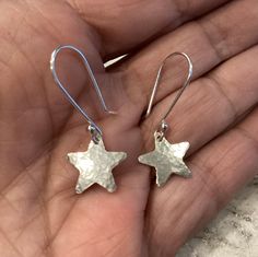 These Silver Star Earrings are a perfect gift for any stargazer, astrology buff or a lovely Christmas accessory. Timeless and ageless these will never go out of style.  The stars are cut from sterling silver sheet and dangle from MetalRocks signature handmade Ear Wires. My ear wires are a little longer than the average at .75 inches.  Should you prefer a smaller ear wire please just let me know.  The stars are a half inch in height and width.  The earrings will come in a lovely black gift box wi Celestial Christmas, Silver Star Earrings, Christmas Gift Idea, Funky Jewelry, Jewelry Lookbook, Jewelry Inspo, Dream Jewelry, Silver Stars, Star Earrings