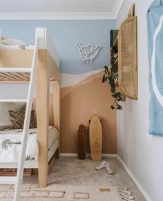 there is a bunk bed in the corner of this room with two beds and a skateboard on the floor