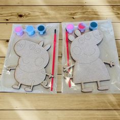 two pieces of paper cut out of the shape of peppa pig with paintbrushes