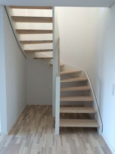 the stairs are made of wood and have no railings or handrails on them