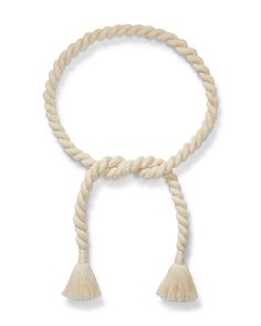 a white rope with tassels on it