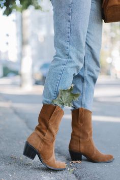 The Chunky Heel Suede Cowgirl Boots are a modern take on an American classic outfit style. These mid-height boots feature a sleek silhouette that blends well with today's trends while remaining true to the clothing of the Old West. They're made from chocolate brown suede that feels like butter, with a unique stitching pattern on the uppers. Finished off with chunky block heels so you can stand out in any crowd--they're perfect for adding some Western style to your daily outfit without sacrificin Fall Moto Boots With Stacked Heel, Western Block Heel Knee-high Boots For Fall, Fall Moto Boots With Stacked Heel And High Ankle, Fall Platform Boots With Reinforced Heel, Mid-calf Platform Boots For Fall, Western Block Heel Boots For Winter, Western Style Block Heel Heeled Boots For Winter, Fall Mid-calf Boots With Stacked Heel, Fall Season Mid-calf Boots With Stacked Heel