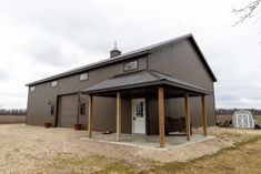 a large brown building sitting on top of a grass covered field