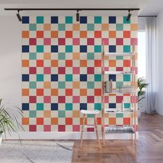 an orange, blue, green and pink checkered wall mural in a living room