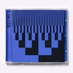 the cd cover is blue and has black squares on it, as well as an image of