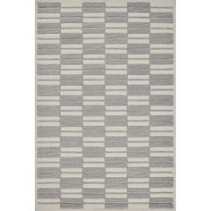 a gray and white rug with squares on the bottom, in different sizes and colors