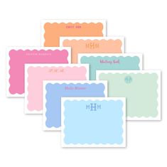 six personalized place cards with scalloped edges and monogrammings on them