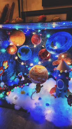 an image of a space scene made out of fake planets and rockets in the sky