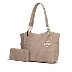 Made of high-quality vegan leather, this purse features a fabric lining, luxurious gold tone embellishments, and an MKF removable charm. It has a zip top closure and metal feet to keep the purse upright. Knitting Tote, Work Tote, Wallet Wristlet, Leather Care, Leather Fabric, Zip Top, Handbag Accessories, Tote Handbags, Burlap Bag