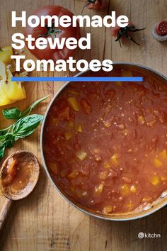 homemade stewed tomatoes in a pot on a wooden table