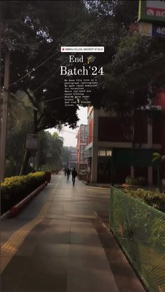 an image of a city street with people walking down the sidewalk and trees on both sides