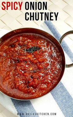 a pan filled with sauce sitting on top of a towel