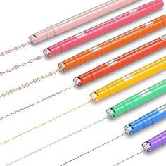 six different colored pens lined up next to each other