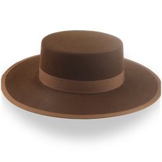 Description Materials Craftsmanship Hat Care Shipping Returns Product Description A Stylish Brown Flat Crown Cowboy Hat Step into the spirit of the West with the Gaucho, a brown flat crown cowboy hat handcrafted from premium rabbit fur felt. Featuring a 3 3/4" crown and a 3 5/8" steel-wired brim, this hat offers the perfect balance of rugged style and functionality. Custom-made for a perfect fit, the Gaucho ensures both comfort and durability. The smooth finish and grosgrain ribbon hatband add a Crown Cowboy Hat, Gaucho Hat, Homburg, Chapeau Cowboy, Big Hat, Brown Flats, Hat Box, Cow Boy, Head Shapes