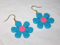 This is a Uniquely Handcrafted pair of Earrings featuring Super Cute & Colorful BLUE FLOWERS Featuring a decorative PINK center - Completely Handmade Artisan Earrings displaying OUTRAGEOUS Details= Earwires are Hypoallergenic. Super FUN- Beautiful Colors Dangle nicely from ears, Light weight. - Length = Please See pictures for ruler measurement & DETAILS :) Please SEE my other listings for MORE fun HOLIDAY THEMED Polymer Clay Earrings Thank You for Looking Please Check out my other items Retro Flower Earrings For Gift, Retro Flower Shaped Earrings For Gift, Retro Flower Shaped Earrings As Gift, Retro Flower Shape Earrings For Gift, Retro Handmade Flower Jewelry, Retro Multicolor Flower Jewelry, Retro Flower-shaped Earrings For Gift, Retro Multicolor Flower Earrings For Gift, Handmade Retro Flower Earrings