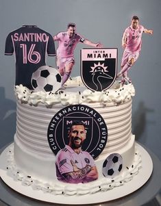 there is a cake decorated with two soccer players on it