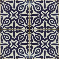 a blue and white tile with an intricate design on the bottom, which has been drawn in