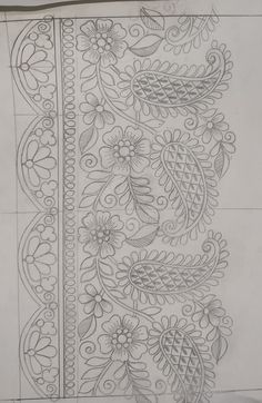 an intricately designed piece of paper with flowers and leaves on it's side