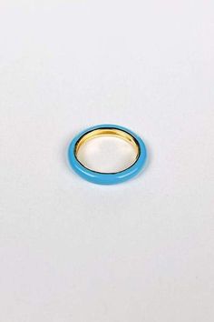 You will love the Axel Blue Enamel Ring.  Feel fun and flirty in the warm light blue that will give any outfit that extra pop of color. The gold inner lining gives this trendy ring an extra bit of flair.  Pair with other multi colored rings for a fun vibrant look. Materials & Care:  14k Gold over 925 Sterling Silver Hypoallergenic and Water Resistant Use a soft microfiber or jewelry cloth to clean Store separate from other jewelry to avoid scratching Avoid direct contact with lotions, perfum Blue Enamel Ring, Blue Enamel Ring With Polished Finish For Gift, Elegant Blue Enamel Ring, Blue Oval Enamel Rings, Blue Polished Enamel Ring, Vintage Blue Enamel Ring For Gift, Colored Rings, Trendy Ring, Enamel Ring