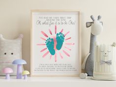 a baby's hand and foot print on a shelf