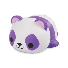 a purple and white panda bear toy laying on its side with it's eyes closed