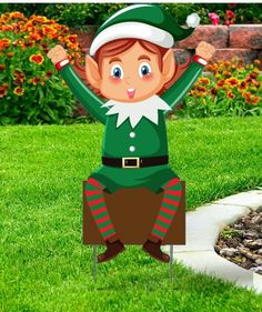 an elf lawn staker is in the grass with his hands up and eyes wide open