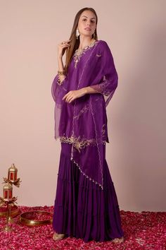 Purple kurta with sequin, bead, cutdana embroidery in floral placement pattern. Paired with tiered gharara and dupatta. - Aza Fashions Festive Gota Work Sharara In Chinon, Diwali Chinon Sharara With Dabka Work, Chinon Sharara With Gota Work, Semi-stitched Chinon Sharara With Gota Work, Designer Georgette Sharara For Diwali, Chinon Sharara With Dabka Work For Navratri, Georgette Sharara For Diwali Designer Wear, Chinon Sharara For Festive Navratri, Festive Georgette Sharara For Diwali