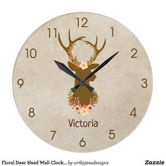 a clock with a deer head and flowers on it's face that says victoria