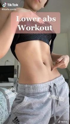 the woman is showing off her toned stomach