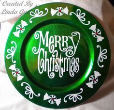 a green plate with merry christmas written on it