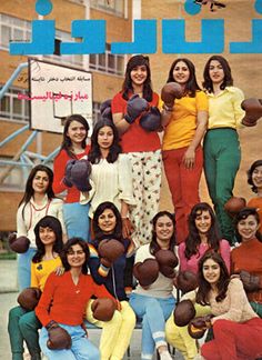 a group of women sitting next to each other in front of a building