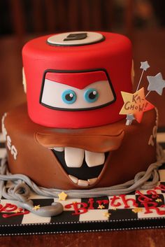 a birthday cake with a hat and stars on it's top is decorated in chocolate