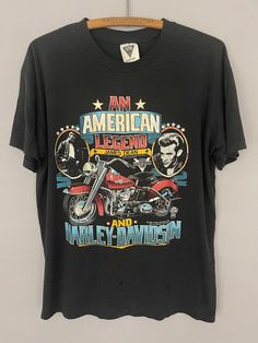 an american legend harley davidson t - shirt hanging on a wall