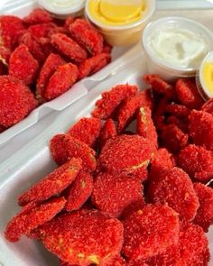 several trays filled with different types of food