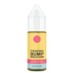 a bottle of piercing bump solution on a white background