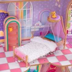 a dollhouse bedroom with a bed, dresser and other furniture in the room that is decorated in pastel colors