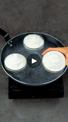 a person is frying some food in a pan