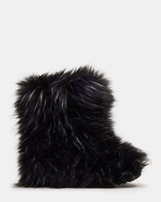 Introducing the BEASTIE bootie! Made with cozy faux fur, these boots will keep your feet warm while adding a touch of playfulness to your style. A must-have for the colder months! .5 inch heel height 17.5 inch shaft circumference 8.5 inch shaft height Faux fur upper material Faux fur lining Faux fur sock Synthetic sole Fit tip: If you are in between sizes, size up a half-size Imported Black Fur Boots, Women's Booties, Fur Boots, Black Faux Fur, 5 Inch Heels, Shoes Booties, Bootie, Bootie Boots, Faux Fur