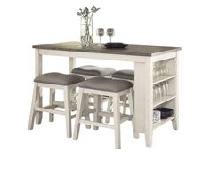 a kitchen table with four stools and a centerpiece on top of the table