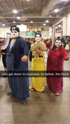 some people in costumes are standing together